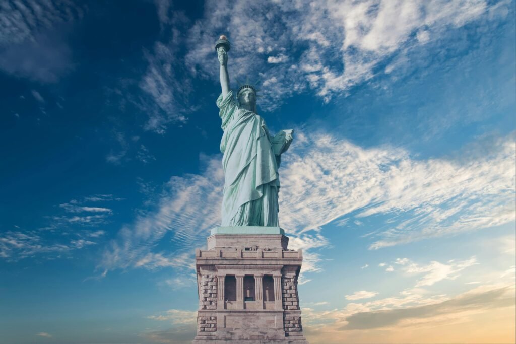 pexels-photo-356844-356844 Iconic Statue of Liberty with a backdrop of a vibrant blue sky, symbolizing freedom and America.